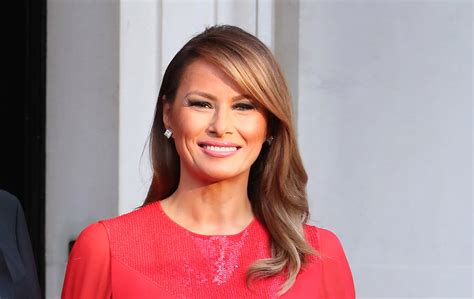 Melania Trump’s Red Dress Sparkles at the Chest at Winfield 